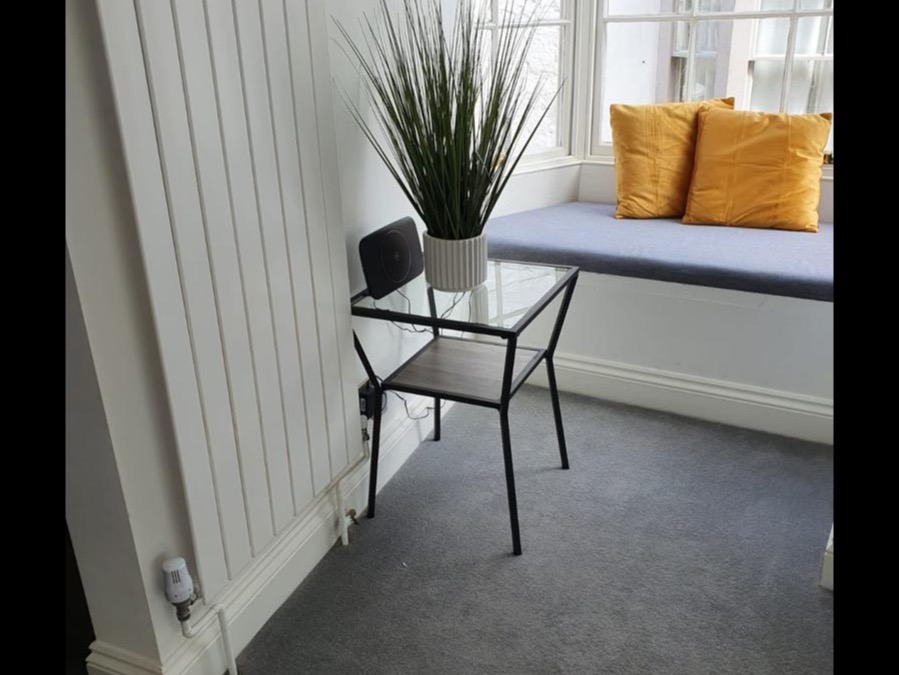 Window seat with cushions overlooking Weymouth street