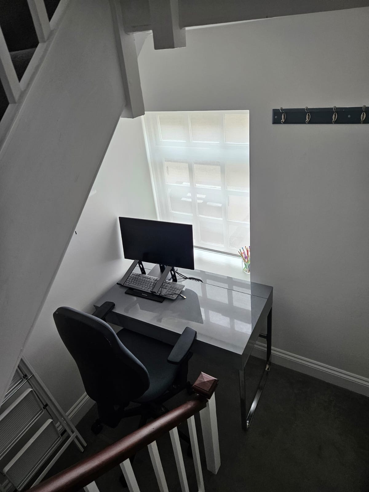 Workspace with desk, monitor and natural light at The Escape Weymouth